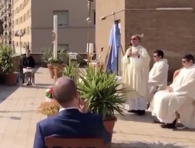 Fr. Carlo Purgatorio celebrates Mass on the rooftop in Rome. Fr. Carlo Purgatorio celebrates Mass on the rooftop in Rome.