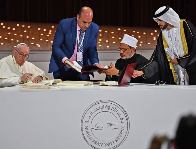 Pope Francis and Egypt's Azhar Grand Imam Sheikh Ahmed al-Tayeb (second from right) sign documents during the Human Fraternity Meeting at the Founders Memorial in Abu Dhabi Feb. 4. Pope Francis and Egypt's Azhar Grand Imam Sheikh Ahmed al-Tayeb (second from right) sign documents during the Human Fraternity Meeting at the Founders Memorial in Abu Dhabi Feb. 4.