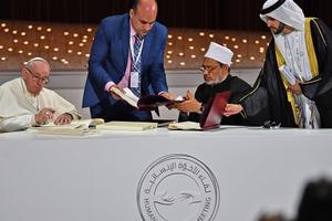 Pope Francis and Egypt's Azhar Grand Imam Sheikh Ahmed al-Tayeb (second from right) sign documents during the Human Fraternity Meeting at the Founders Memorial in Abu Dhabi Feb. 4. Pope Francis and Egypt's Azhar Grand Imam Sheikh Ahmed al-Tayeb (second from right) sign documents during the Human Fraternity Meeting at the Founders Memorial in Abu Dhabi Feb. 4.