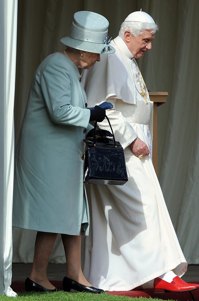 Britain's Queen Elizabeth II and Pope Benedict XVI walk through the gardens at the Royal Palace of Holyroodhouse in Edinburgh, Scotland, Sept. 16. Britain's Queen Elizabeth II and Pope Benedict XVI walk through the gardens at the Royal Palace of Holyroodhouse in Edinburgh, Scotland, Sept. 16.