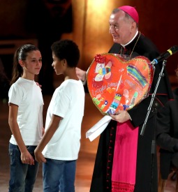 Archbishop Pietro Parolin, the Vatican's Secretary of State, participating with two children at a Dec. 2 benefit concert at the Vatican for the Bambino Gesu pediatric hospital. Archbishop Pietro Parolin, the Vatican's Secretary of State, participating with two children at a Dec. 2 benefit concert at the Vatican for the Bambino Gesu pediatric hospital.
