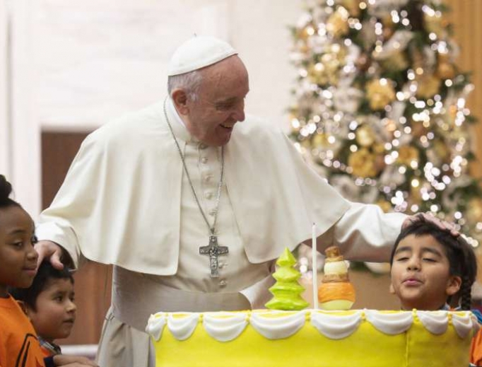 Pope Francis celebrates his 82nd birthday a day early with young patients of the Santa Marta Pediatric Dispensary Dec. 16. Pope Francis celebrates his 82nd birthday a day early with young patients of the Santa Marta Pediatric Dispensary Dec. 16.