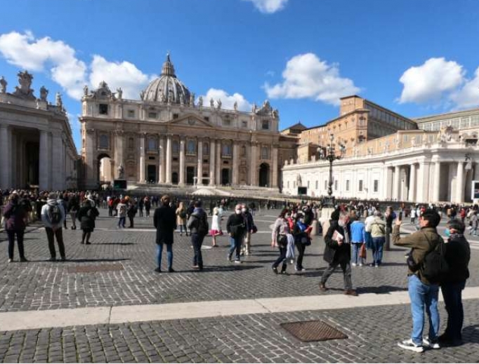 Pilgrims in St. Peter's Square watch the video broadcast of the Angelus March 8. Pilgrims in St. Peter's Square watch the video broadcast of the Angelus March 8.