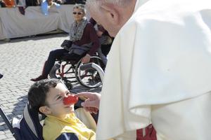 Pope Francis with a child in St. Peter's Square during the general audience on Feb. 24.
Pope Francis with a child in St. Peter's Square during the general audience on Feb. 24.
