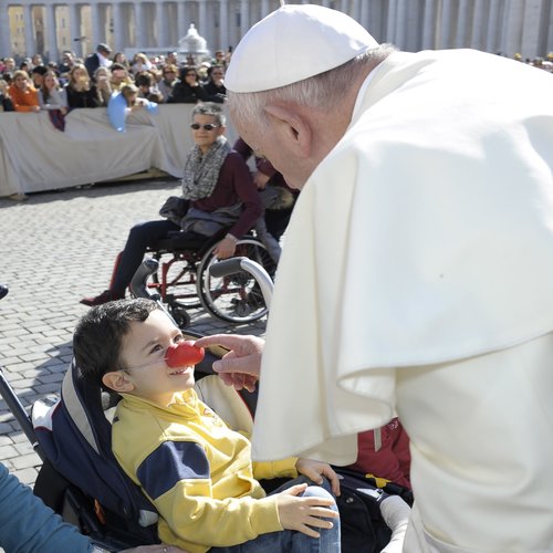Pope Francis with a child in St. Peter's Square during the general audience on Feb. 24.
Pope Francis with a child in St. Peter's Square during the general audience on Feb. 24.