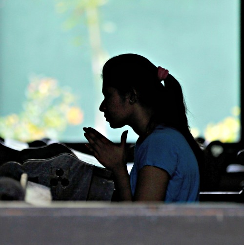 A Sri Lankan Catholic prays at a church in the capital city of Colombo. A Sri Lankan Catholic prays at a church in the capital city of Colombo.