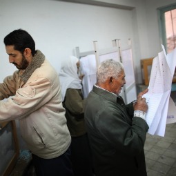 A man votes, and another studies his choices at a polling station in the Shubra district on the second day of voting on Nov. 29 in Cairo, Egypt. Eleven months after the fall of Hosni Mubarak 45 million Egyptians are electing members parliament. The complicated process will take four months to conclude. Presidential elections are expected to be held in 2012. A man votes, and another studies his choices at a polling station in the Shubra district on the second day of voting on Nov. 29 in Cairo, Egypt. Eleven months after the fall of Hosni Mubarak 45 million Egyptians are electing members parliament. The complicated process will take four months to conclude. Presidential elections are expected to be held in 2012.