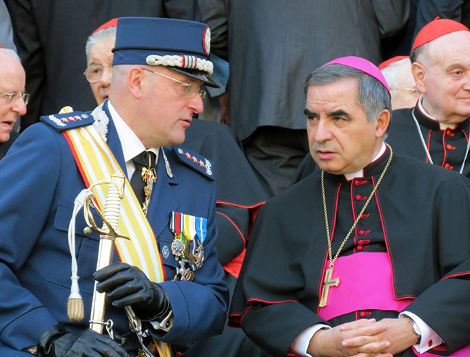 Then-Archbishop Angelo Becciu, as substitute at the Secretariat of State, with Vatican Gendarme Captain Domenico Giani in 2012. Then-Archbishop Angelo Becciu, as substitute at the Secretariat of State, with Vatican Gendarme Captain Domenico Giani in 2012.