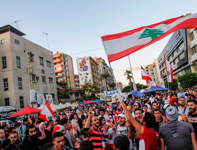 Lebanese anti-government protesters celebrate the resignation of Prime Minister Saad Hariri in the southern city of Sidon on Oct. 29 on the 13th day of anti-government protests. Lebanese anti-government protesters celebrate the resignation of Prime Minister Saad Hariri in the southern city of Sidon on Oct. 29 on the 13th day of anti-government protests.