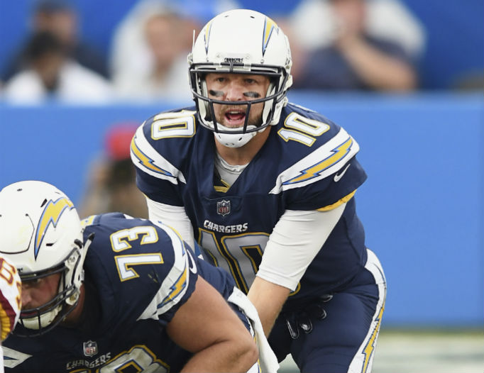Los Angeles Chargers quarterback Kellen Clemens (10) takes the snap from center in the fourth quarter of a game against the Washington Redskins Dec. 10, 2017. Los Angeles Chargers quarterback Kellen Clemens (10) takes the snap from center in the fourth quarter of a game against the Washington Redskins Dec. 10, 2017.