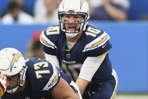 Los Angeles Chargers quarterback Kellen Clemens (10) takes the snap from center in the fourth quarter of a game against the Washington Redskins Dec. 10, 2017. Los Angeles Chargers quarterback Kellen Clemens (10) takes the snap from center in the fourth quarter of a game against the Washington Redskins Dec. 10, 2017.
