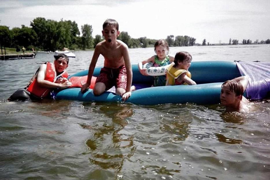 Tyler (left, in the life vest) and his family Tyler (left, in the life vest) and his family