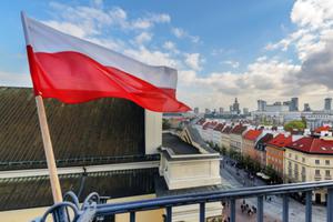 Polish flag waving near Warsaw's city center. Polish flag waving near Warsaw's city center.