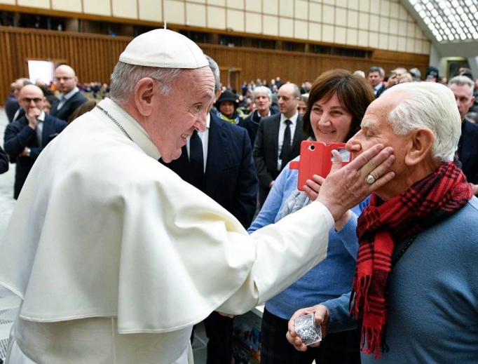 Pope Francis greets a man during his weekly General Audience, January 15, 2020. Pope Francis greets a man during his weekly General Audience, January 15, 2020.