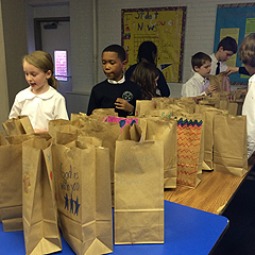 Students at St. Peter's School in Washington make breakfast bags for the homeless. Students at St. Peter's School in Washington make breakfast bags for the homeless.