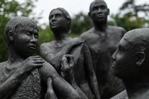 A picture taken on May 12, 2020 shows a statue by British artist Martin William and representing a child receiving a vaccine in front of the World Health Organization (WHO) headquarters in Geneva, amid the COVID-19 outbreak, caused by the novel coronavirus. A picture taken on May 12, 2020 shows a statue by British artist Martin William and representing a child receiving a vaccine in front of the World Health Organization (WHO) headquarters in Geneva, amid the COVID-19 outbreak, caused by the novel coronavirus.