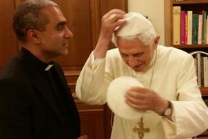Msgr. Anthony Figueiredo exhanges a zucchettos with Pope Emeritus Benedict XVI at the Vatican on Nov. 7. Msgr. Anthony Figueiredo exhanges a zucchettos with Pope Emeritus Benedict XVI at the Vatican on Nov. 7.