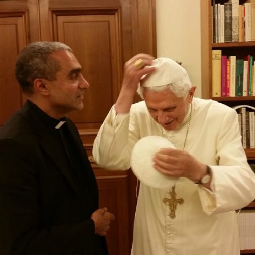 Msgr. Anthony Figueiredo exhanges a zucchettos with Pope Emeritus Benedict XVI at the Vatican on Nov. 7. Msgr. Anthony Figueiredo exhanges a zucchettos with Pope Emeritus Benedict XVI at the Vatican on Nov. 7.