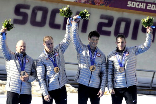 Curt Tomasevicz, second from left, poses with his bobsled teammates who won a bronze medal at the Sochi Winter Olympics. Curt Tomasevicz, second from left, poses with his bobsled teammates who won a bronze medal at the Sochi Winter Olympics.