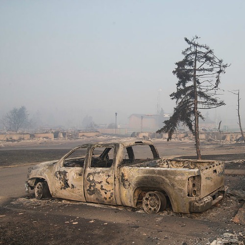 Home foundations and shells of vehicles are nearly all that remain in a residential neighborhood destroyed by a wildfire on May 6, in Fort McMurray, Alberta. Home foundations and shells of vehicles are nearly all that remain in a residential neighborhood destroyed by a wildfire on May 6, in Fort McMurray, Alberta.