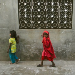 WALKING IN FEAR. Girls walk through a street in Gojra town, located in Punjab province. Residents of the neighborhood, known as Christian Colony, are haunted, since 2009, by memories of Muslim attacks on families there. WALKING IN FEAR. Girls walk through a street in Gojra town, located in Punjab province. Residents of the neighborhood, known as Christian Colony, are haunted, since 2009, by memories of Muslim attacks on families there.