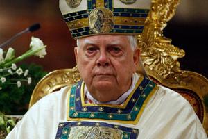 Cardinal Bernard Law celebrates Mass during a ceremony for Our Lady of the Snows in the Basilica of St. Mary Major in Rome in 2010. Cardinal Law, who resigned in disgrace for his role in the clergy sex-abuse scandal in Boston, died Wednesday. Below, Cardinal Law, answers a question from attorney Mitchell Garabedian, in Boston's Suffolk Superior Court Aug. 2, 2002, regarding his knowledge and handling of the Father John Geoghan child sex-abuse case. Cardinal Bernard Law celebrates Mass during a ceremony for Our Lady of the Snows in the Basilica of St. Mary Major in Rome in 2010. Cardinal Law, who resigned in disgrace for his role in the clergy sex-abuse scandal in Boston, died Wednesday. Below, Cardinal Law, answers a question from attorney Mitchell Garabedian, in Boston's Suffolk Superior Court Aug. 2, 2002, regarding his knowledge and handling of the Father John Geoghan child sex-abuse case.