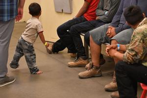 Young children are shown with their families at the U.S. Customs and Border Protection Facility in Tucson, Arizona, during a visit by First Lady Melania Trump June 28. Young children are shown with their families at the U.S. Customs and Border Protection Facility in Tucson, Arizona, during a visit by First Lady Melania Trump June 28.
