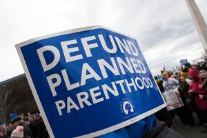 March for Life sign calls for the defunding of Planned Parenthood. March for Life sign calls for the defunding of Planned Parenthood.