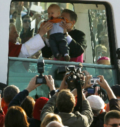 Pope Benedict XVI prepares to bless a child inside the popemobile as he arrives for the celebration of the Eucharist on the former airport site in Freiburg Pope Benedict XVI prepares to bless a child inside the popemobile as he arrives for the celebration of the Eucharist on the former airport site in Freiburg