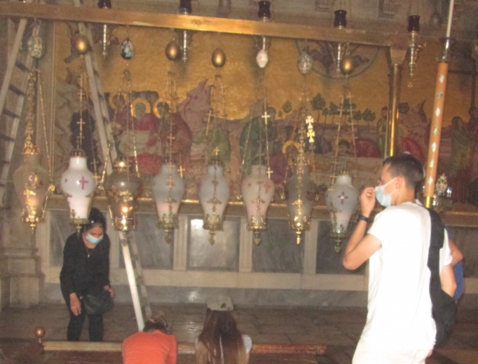Closed for two months to stop the spread of the novel coronavirus, the Church of the Holy Sepulcher is now open to the public, but only 50 people at a time may pray inside. Above, pilgrims living in Israel pray in the Church of the Holy Sepulcher. Closed for two months to stop the spread of the novel coronavirus, the Church of the Holy Sepulcher is now open to the public, but only 50 people at a time may pray inside. Above, pilgrims living in Israel pray in the Church of the Holy Sepulcher.