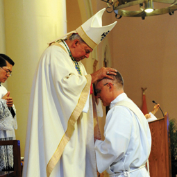 CHAPLAIN PRIEST. Bishop Sam Jacobs of Houma-Thibodaux, La., ordains Stu King a Catholic priest during a Mass May 26 at the Cathedral of St. Francis de Sales in Houma. CHAPLAIN PRIEST. Bishop Sam Jacobs of Houma-Thibodaux, La., ordains Stu King a Catholic priest during a Mass May 26 at the Cathedral of St. Francis de Sales in Houma.