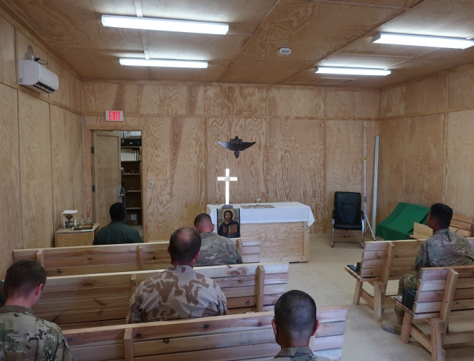 Father Michael Creagan, shown below holding up the jaguar mascot of the Catholic school at St. Joseph parish in West St. Paul, Minnesota, made sure soldiers in Afghanistan had access to Mass (his Mass kit is shown below) and adoration (shown above). Father Michael Creagan, shown below holding up the jaguar mascot of the Catholic school at St. Joseph parish in West St. Paul, Minnesota, made sure soldiers in Afghanistan had access to Mass (his Mass kit is shown below) and adoration (shown above).