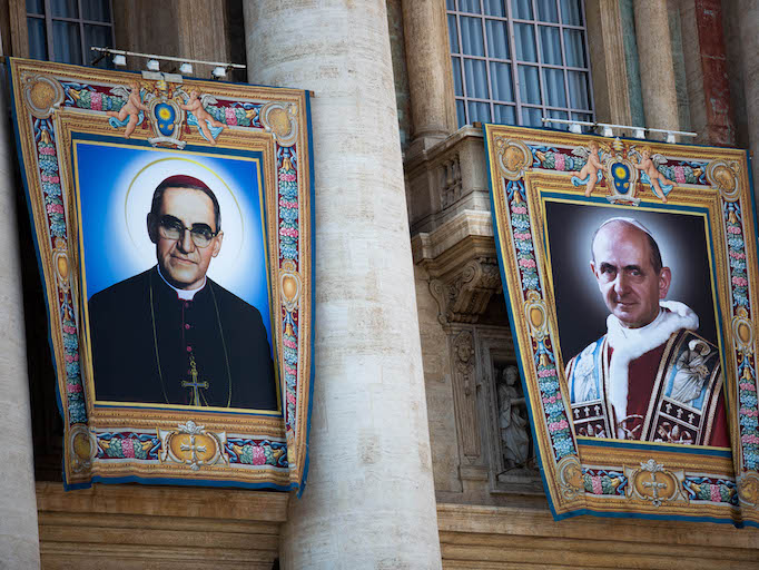 Banners hanging in front of St. Peter's Basilica during the canonization mass of Sts. Paul VI (right) and Oscar Romero (left). Banners hanging in front of St. Peter's Basilica during the canonization mass of Sts. Paul VI (right) and Oscar Romero (left).