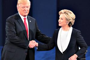 Republican presidential nominee Donald Trump shakes hands with Democratic presidential nominee Hillary Clinton during the town hall debate at Washington University on Oct. 9 in St Louis. The two will attend the annual Al Smith fundraiser in New York tonight. Republican presidential nominee Donald Trump shakes hands with Democratic presidential nominee Hillary Clinton during the town hall debate at Washington University on Oct. 9 in St Louis. The two will attend the annual Al Smith fundraiser in New York tonight.