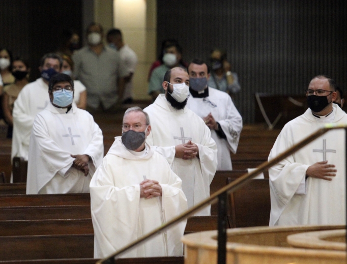 Above, priests from the Rio Grande Valley wear face masks against the spread of the coronavirus as they attend a priestly ordination Mass June 20 at the Basilica of Our Lady of San Juan Del Valle in San Juan, Texas. Above, priests from the Rio Grande Valley wear face masks against the spread of the coronavirus as they attend a priestly ordination Mass June 20 at the Basilica of Our Lady of San Juan Del Valle in San Juan, Texas.