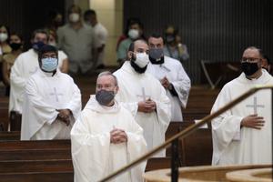 Above, priests from the Rio Grande Valley wear face masks against the spread of the coronavirus as they attend a priestly ordination Mass June 20 at the Basilica of Our Lady of San Juan Del Valle in San Juan, Texas. Above, priests from the Rio Grande Valley wear face masks against the spread of the coronavirus as they attend a priestly ordination Mass June 20 at the Basilica of Our Lady of San Juan Del Valle in San Juan, Texas.