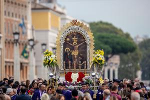 An image of the Crucifixion is held aloft at the Oct. 20 Angelus. An image of the Crucifixion is held aloft at the Oct. 20 Angelus.