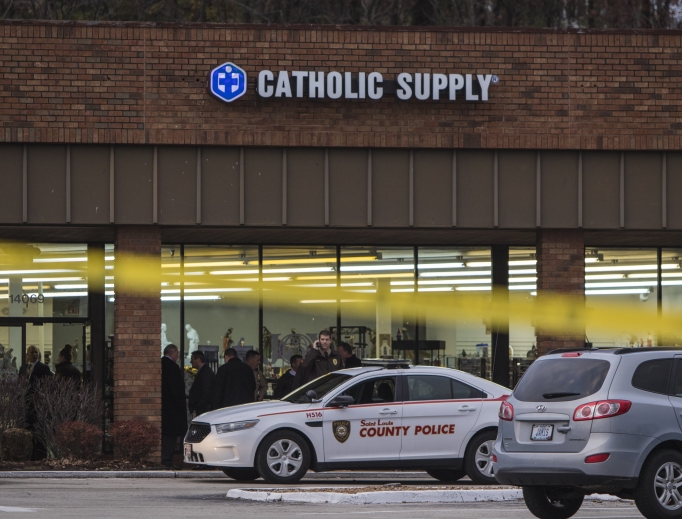 Authorities investigate the scene at Catholic Supply retail store where a gunman went into the religious supply store, sexually assaulted at least one woman and shot a woman in the head Nov. 19 in Ballwin, Missouri. Authorities investigate the scene at Catholic Supply retail store where a gunman went into the religious supply store, sexually assaulted at least one woman and shot a woman in the head Nov. 19 in Ballwin, Missouri.