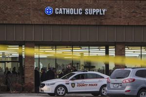 Authorities investigate the scene at Catholic Supply retail store where a gunman went into the religious supply store, sexually assaulted at least one woman and shot a woman in the head Nov. 19 in Ballwin, Missouri. Authorities investigate the scene at Catholic Supply retail store where a gunman went into the religious supply store, sexually assaulted at least one woman and shot a woman in the head Nov. 19 in Ballwin, Missouri.