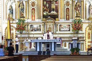 A priest offers Mass at the near-empty Basilica of the Lord of Miracles in Buga, Colombia, Tuesday after it was closed as a preventive measure to limit the spread of the novel coronavirus COVID-19. A priest offers Mass at the near-empty Basilica of the Lord of Miracles in Buga, Colombia, Tuesday after it was closed as a preventive measure to limit the spread of the novel coronavirus COVID-19.