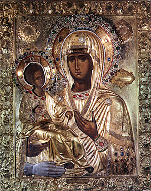 Icon of Mary as the Theotokos. The hand in silver at the bottom is a votive offering related to a miracle of St. John Damascene. Icon of Mary as the Theotokos. The hand in silver at the bottom is a votive offering related to a miracle of St. John Damascene.
