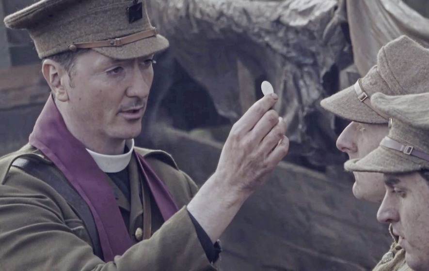 Above, Father Willie Doyle (portrayed by Brian Milligan) distributes Communion to soldiers on the battlefield in Bravery Under Fire Above, Father Willie Doyle (portrayed by Brian Milligan) distributes Communion to soldiers on the battlefield in Bravery Under Fire