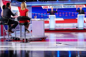 Moderators Univision's journalist Ilia Calderon (hidden), CNN chief Washington correspondent Jake Tapper and CNN political correspondent Dana Bash listen to Democratic presidential hopefuls former U.S. vice president Joe Biden and Vermont Senator Bernie Sanders take part in the 11th Democratic Party 2020 presidential debate in a CNN Washington Bureau studio in Washington, D.C., Sunday night. Moderators Univision's journalist Ilia Calderon (hidden), CNN chief Washington correspondent Jake Tapper and CNN political correspondent Dana Bash listen to Democratic presidential hopefuls former U.S. vice president Joe Biden and Vermont Senator Bernie Sanders take part in the 11th Democratic Party 2020 presidential debate in a CNN Washington Bureau studio in Washington, D.C., Sunday night.
