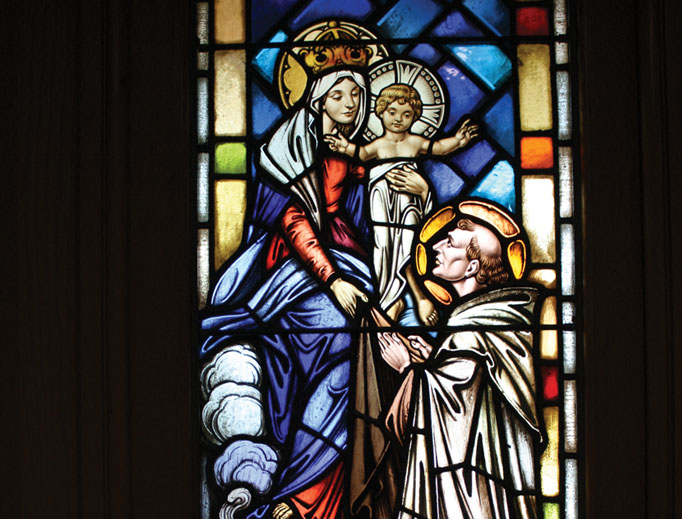 A window at the National Shrine of Our Lady of Mount Carmel in Middletown, New York, depicts Our Lady appearing to St. Simon Stock in 1251 in Aylesford, England, to give him the Brown Scapular. A window at the National Shrine of Our Lady of Mount Carmel in Middletown, New York, depicts Our Lady appearing to St. Simon Stock in 1251 in Aylesford, England, to give him the Brown Scapular.