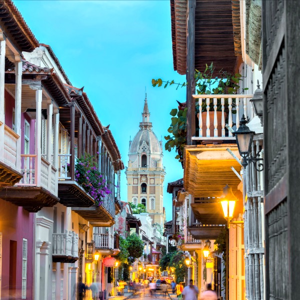 Street view of Cartagena, Colombia, after sunset with cathedral visible in the background. Street view of Cartagena, Colombia, after sunset with cathedral visible in the background.