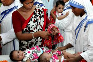 Missionaries of Charity sisters and assistants tend to young orphans during a pilgrimage to the tomb of Mother Teresa in Kolkata, India. Missionaries of Charity sisters and assistants tend to young orphans during a pilgrimage to the tomb of Mother Teresa in Kolkata, India.