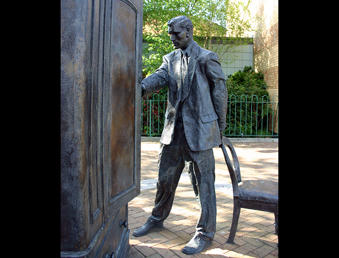 Entitled ‘The Searcher’, this Belfast statue of C.S. Lewis looking into a wardrobe was sculpted by Ross Wilson. Entitled ‘The Searcher’, this Belfast statue of C.S. Lewis looking into a wardrobe was sculpted by Ross Wilson.
