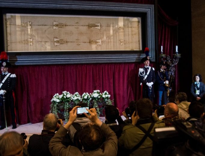 Above, pilgrims visit the exposition of the Shroud of Turin in Turin, Italy, on April 18, 2015. Below, an exhibit on the shroud on Sept. 12, 2017. Above, pilgrims visit the exposition of the Shroud of Turin in Turin, Italy, on April 18, 2015. Below, an exhibit on the shroud on Sept. 12, 2017.