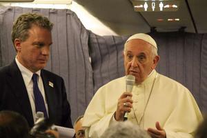 Pope Francis speaks aboard the papal plane from Lima, Peru to Rome Jan. 22.
