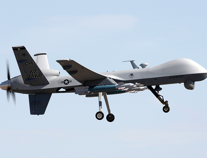 An MQ-9 Reaper flies above Creech AFB during a training mission. An MQ-9 Reaper flies above Creech AFB during a training mission.